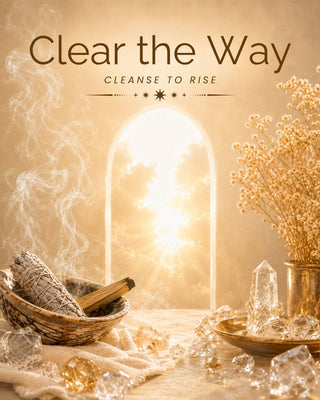 A warm-toned spiritual or wellness graphic with the text 'Clear the Way' and 'CLEANSE TO RISE' above an arched window of bright light. The scene includes dried flowers in a vase, crystals, a smudge bundle in a basket, and a cloth-covered surface in a beige and gold palette.