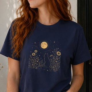 Navy Moonlit Cat tee with a gold cat among wildflowers under a full moon, shown on a model