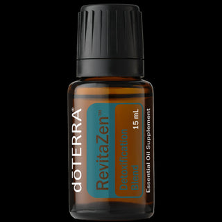 A 15 mL amber glass bottle of doTERRA RevitaZen Detoxification Blend essential oil supplement with a black ribbed cap, shown against a solid black background.