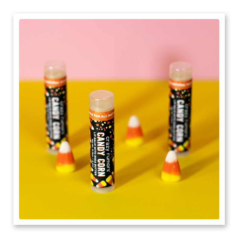 Candy corn lip balm with yellow background