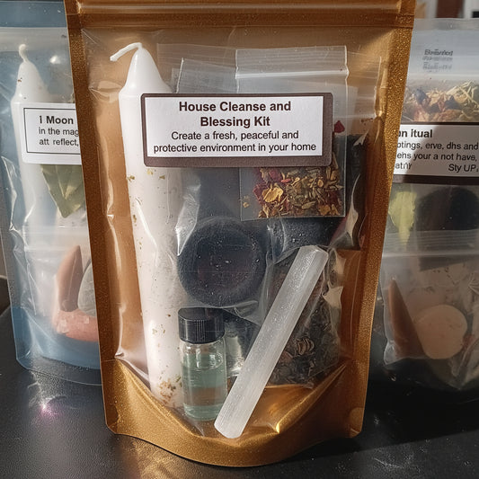 House Cleanse and Blessing Kit with candle, crystals, and other items in a clear bag.