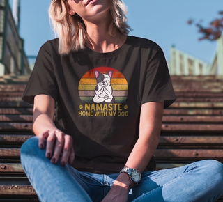 Black heather Namaste Home With My Dog t-shirt worn by a person sitting on steps, meditating French bulldog under retro sunset stripes