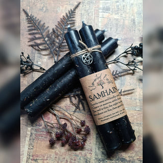 Samhain ritual black taper candles with herbs