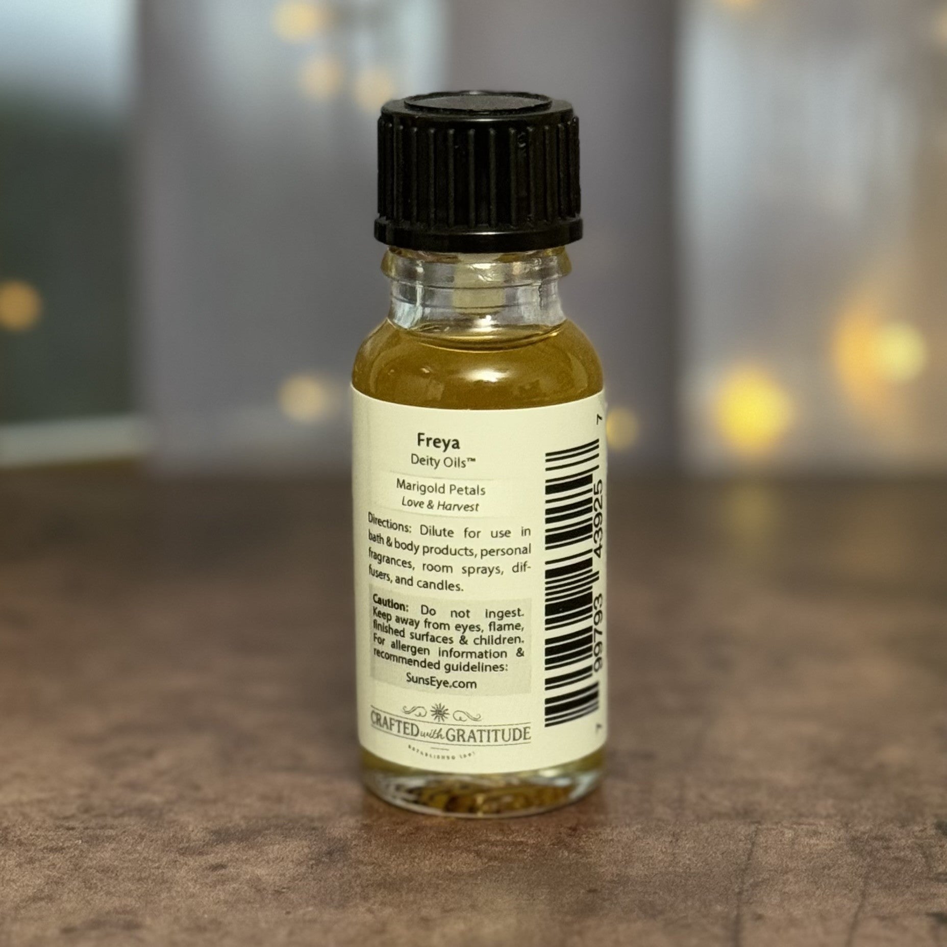 Small bottle with a label on a wooden surface