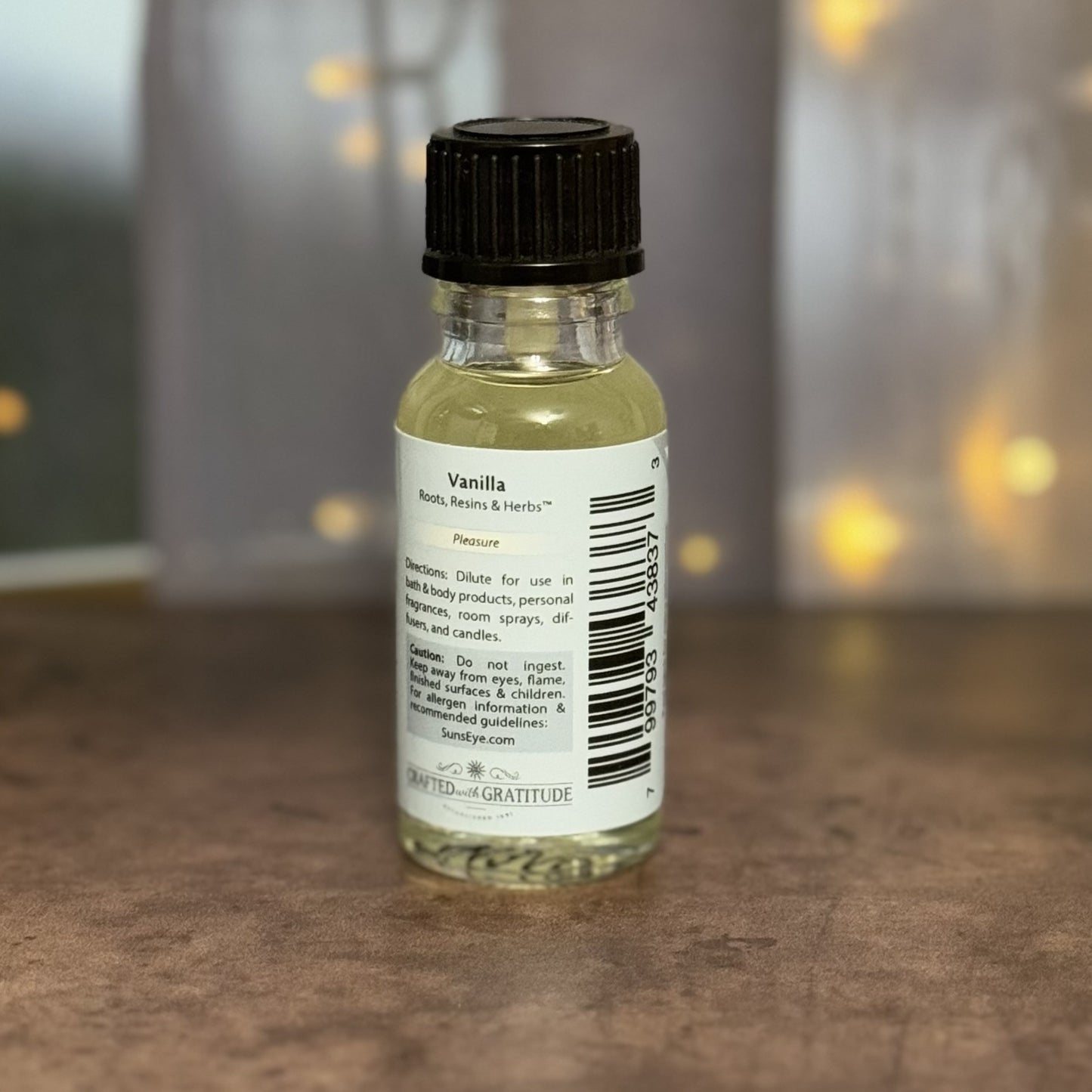 Small bottle with a label on a wooden surface