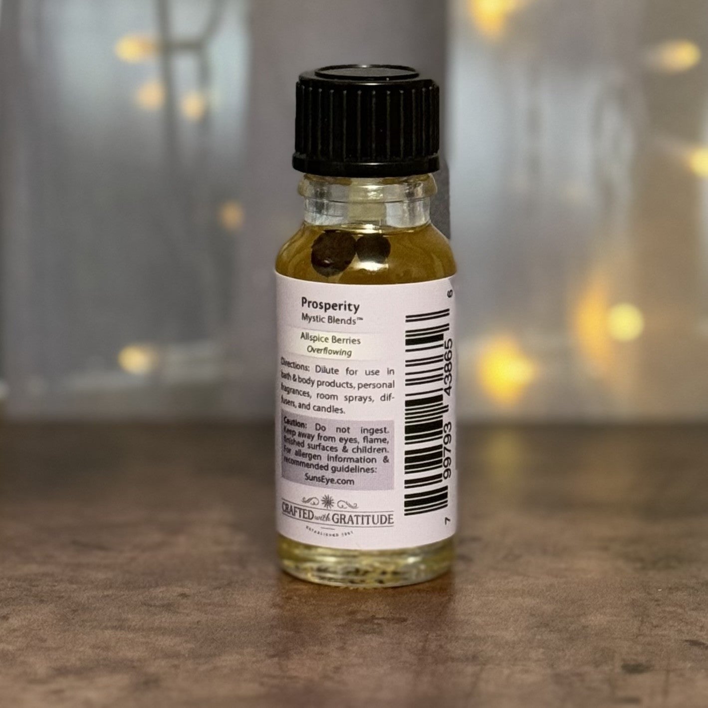 Small bottle with a label on a wooden surface