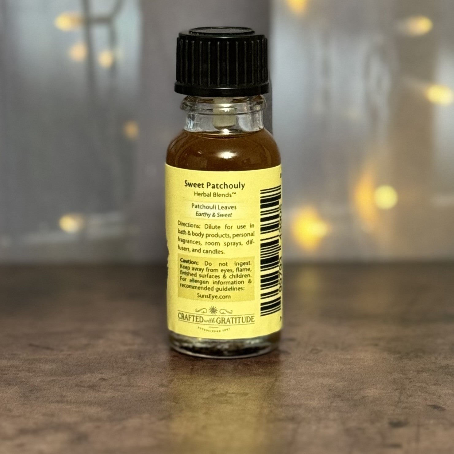 Bottle of Sweet Patchouli essential oil with a blurred background