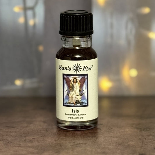 Bottle of Sun's Eye Isis concentrated aroma on a wooden surface with a blurred background