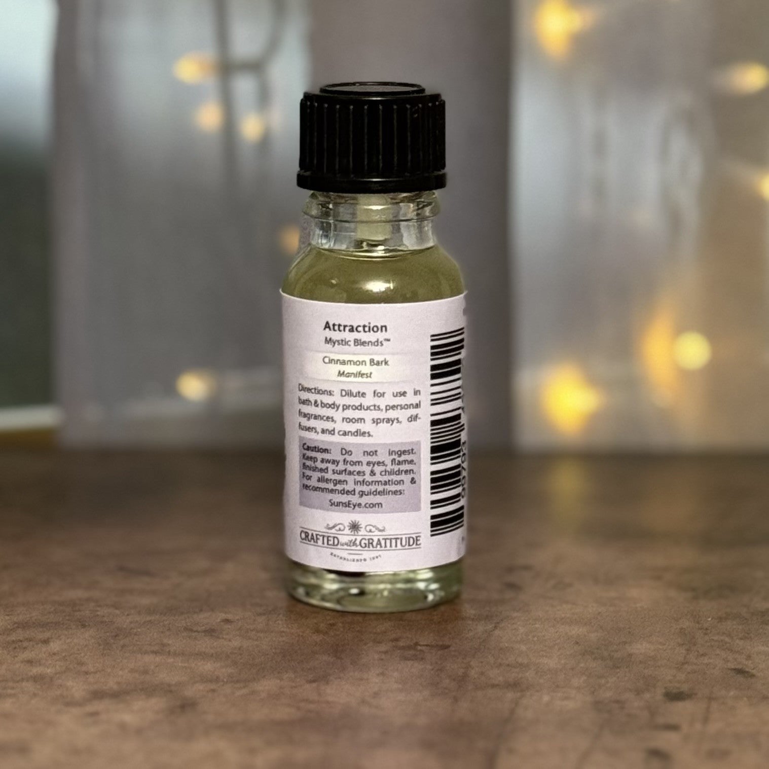 Small glass bottle with a label on a wooden surface