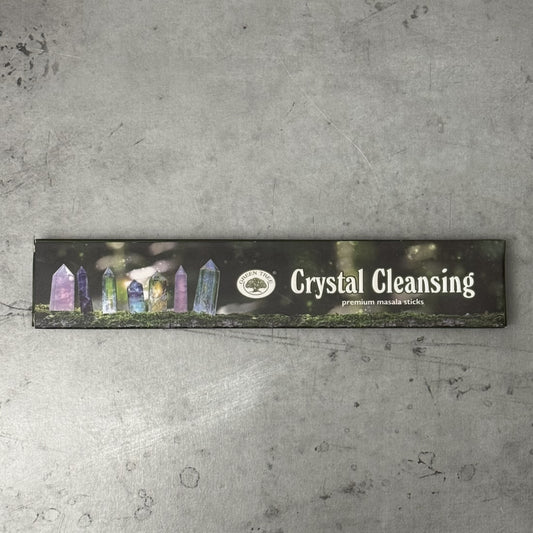 Box of Crystal Cleansing Green Tree premium incense sticks on a textured surface