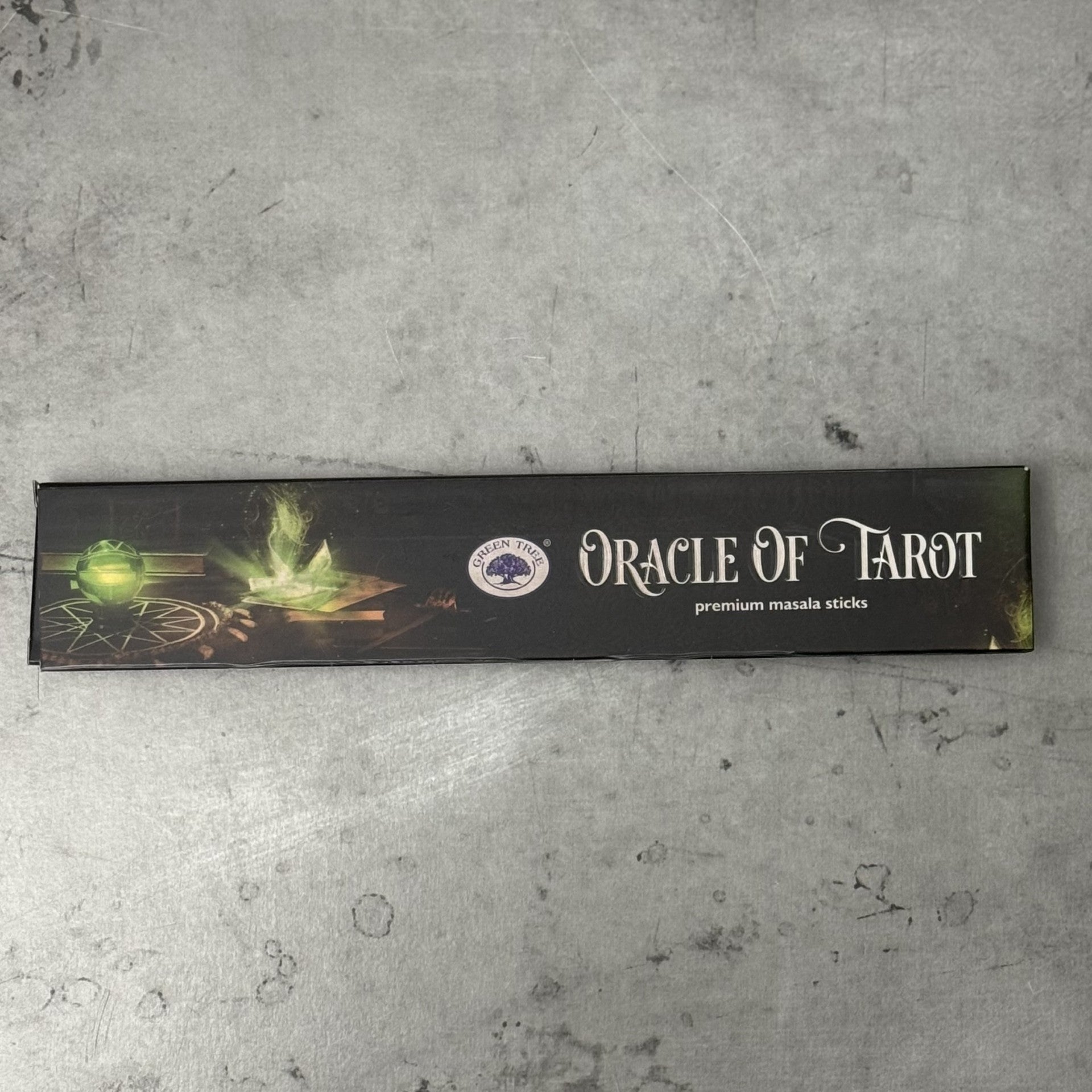 Box of Oracle of Tarot Green Tree premium masala sticks on a gray surface