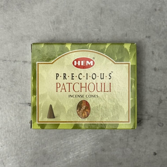 Box of HEM Precious Patchouli incense cones on a gray background