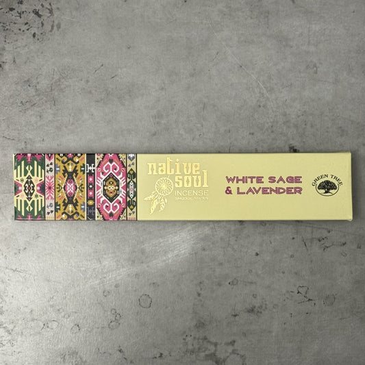 Incense sticks with colorful packaging on a gray surface