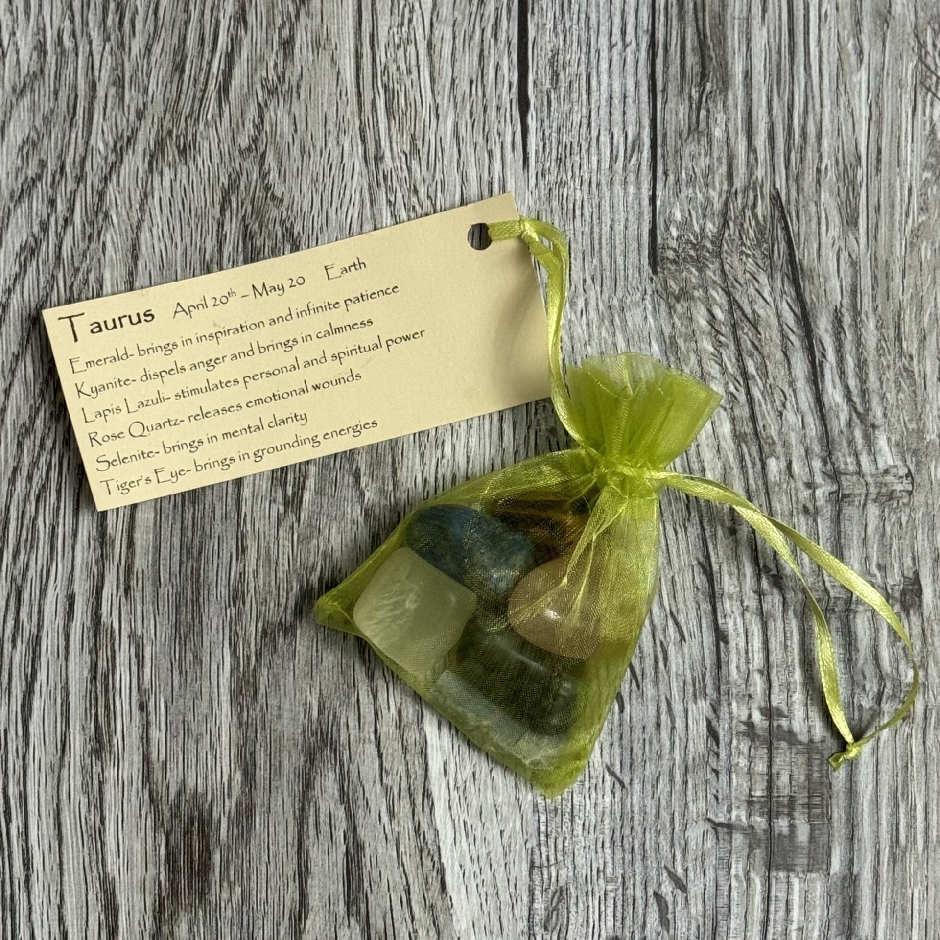 Bag of stones with a tag on a wooden surface
