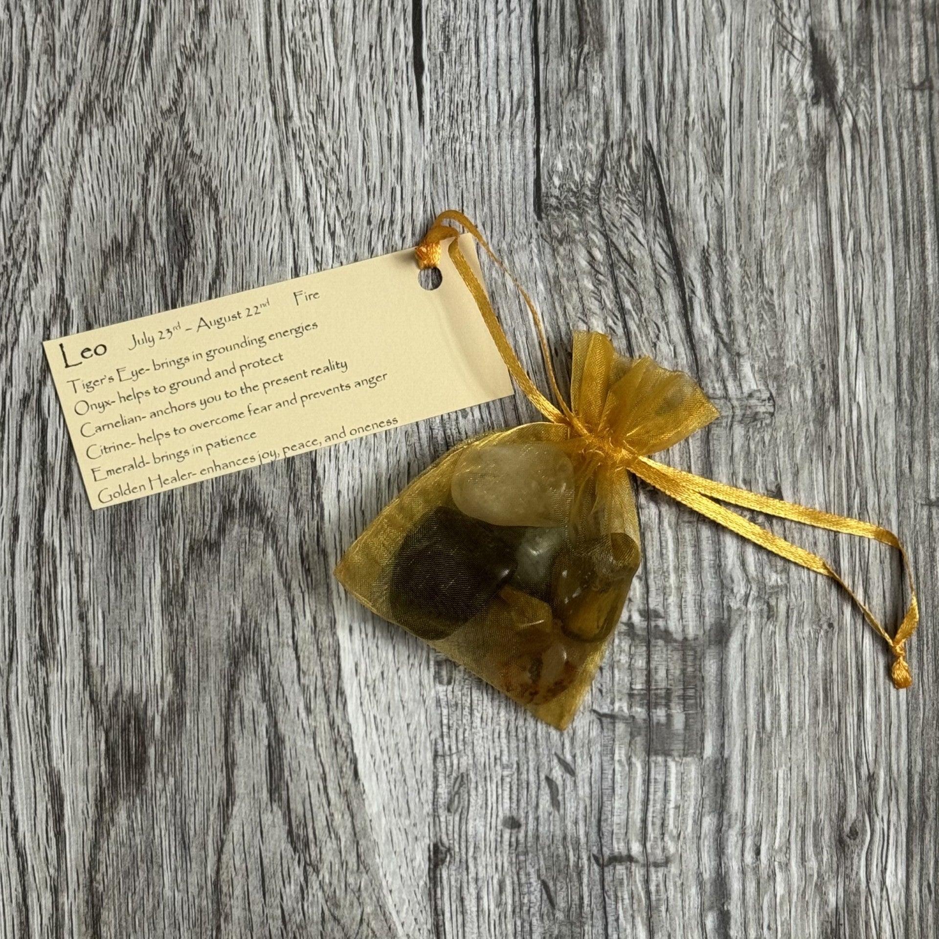 Bag of stones with a tag on a wooden surface