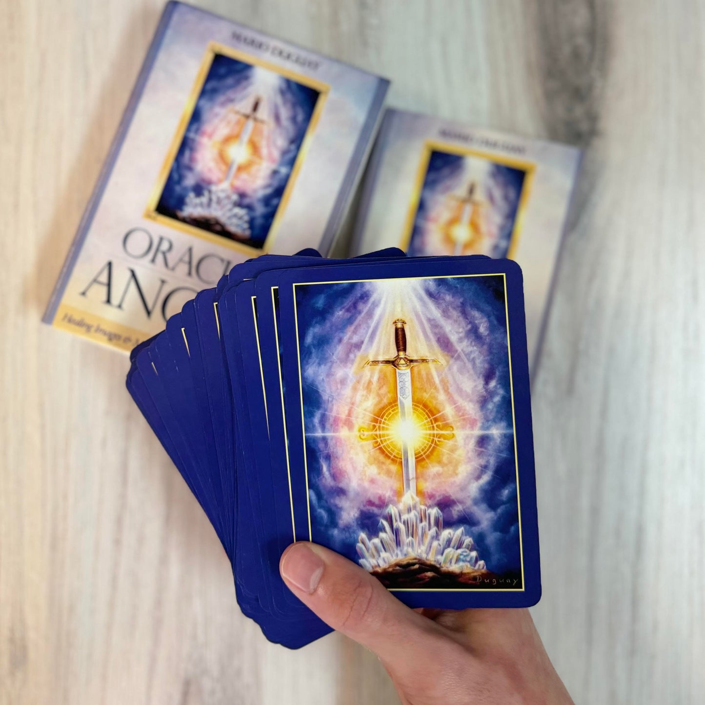 oracle of the angels cards in hand