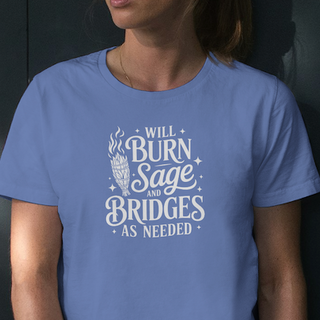 Model wearing a Heather True Royal blue tee with white hand-lettered 'Will burn sage and bridges as needed' design